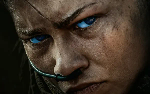 5K Ultra HD desktop wallpaper — intense close-up portrait with piercing blue eyes, dirt-smudged skin and a comms headset, cinematic Dune: Part Three vibe.