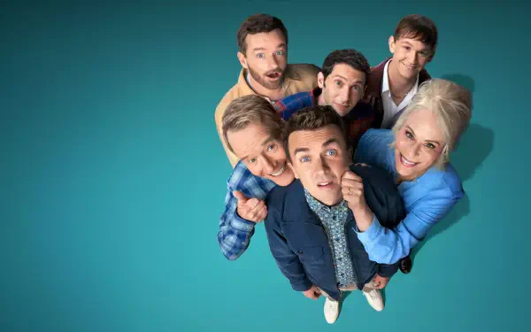 4K Ultra HD PC wallpaper titled Malcom in the Middle: Life's Still Unfair — seven people in casual clothes clustered and looking up at the viewer on a teal background.