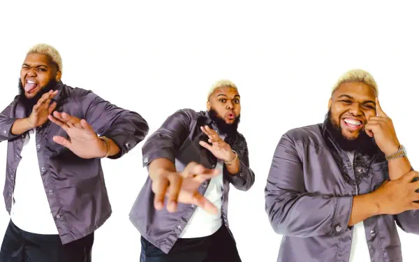 HD PC wallpaper: three playful poses of a blonde-haired content creator in a gray shirt smiling and gesturing against a white background.