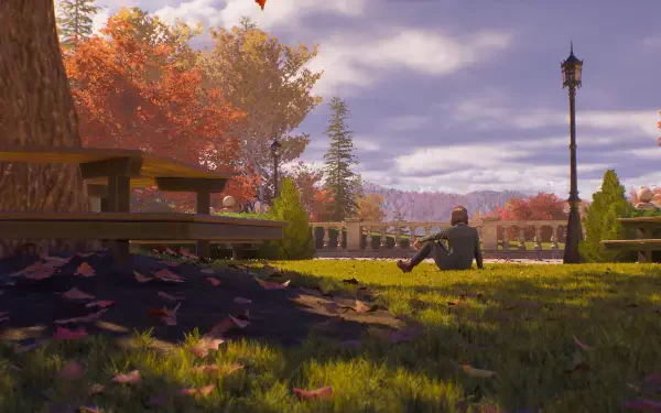 4K Ultra HD PC desktop wallpaper from the video game Life is Strange: Reunion — a lone character sits on grass beneath autumn trees by a bench and lamppost.