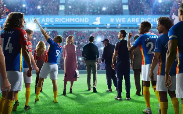 Ted Lasso 4K Ultra HD PC desktop wallpaper: the coach and his squad walk onto a vibrant stadium pitch beneath a WE ARE RICHMOND banner.