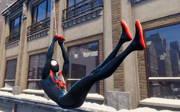 Spider-Man in a black-and-red suit swings on a web past snowy city windows — video game scene in 4K Ultra HD PC Desktop Wallpaper and Background.