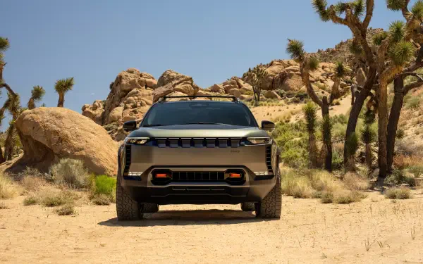 Front view of a Jeep Wagoneer S SUV parked in a sunlit desert with Joshua trees — 4K Ultra HD PC desktop wallpaper background.