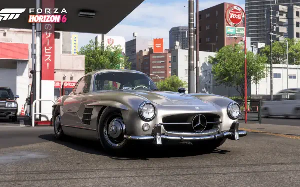 Forza Horizon 6 video game 4K Ultra HD PC desktop wallpaper/background: silver classic Mercedes 300SL parked at a city gas station with an urban skyline under bright daylight.
