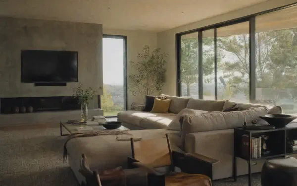 Modern home living room with sectional sofa, floor-to-ceiling windows and wall-mounted TV — 4K Ultra HD PC Desktop Wallpaper and Background.