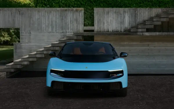 Light-blue Ferrari Luce vehicle, front view parked before concrete steps and reflecting pool — 4K Ultra HD PC desktop wallpaper/background.
