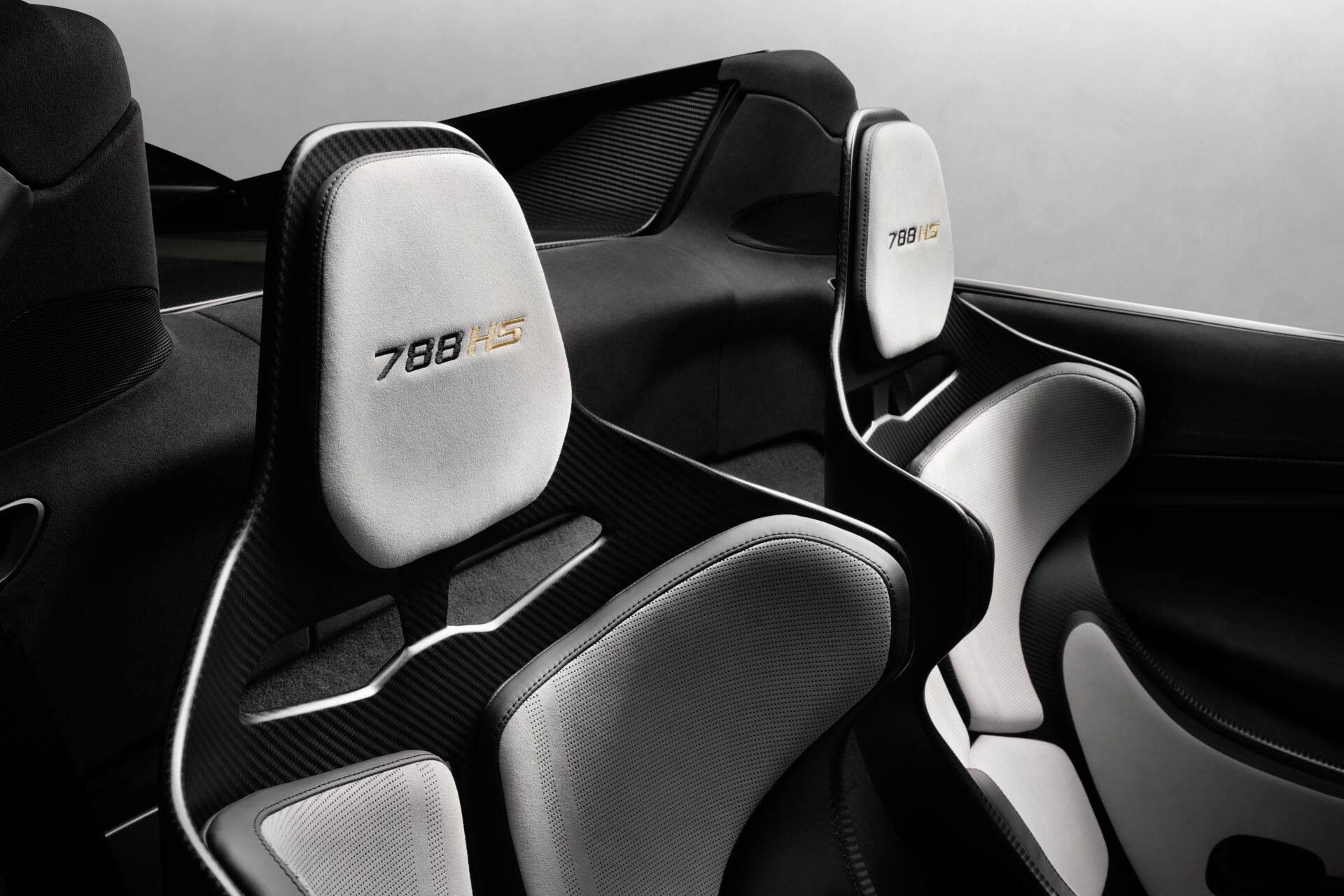 McLaren 788HS vehicle interior: carbon-fiber cockpit and white racing seats, 8K Ultra HD PC desktop wallpaper/background.