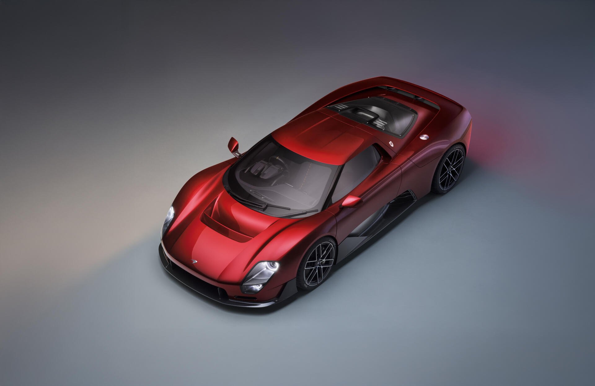 Red McLaren McL 6GT sports car in studio lighting, 8K Ultra HD PC desktop wallpaper and background.