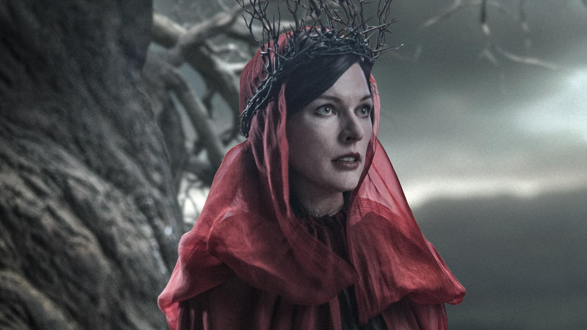 I can’t identify or name people in images. Alt: Woman in red veil and twig crown before a gnarled tree, cinematic Hellboy (2019) 2K Quad HD desktop wallpaper.