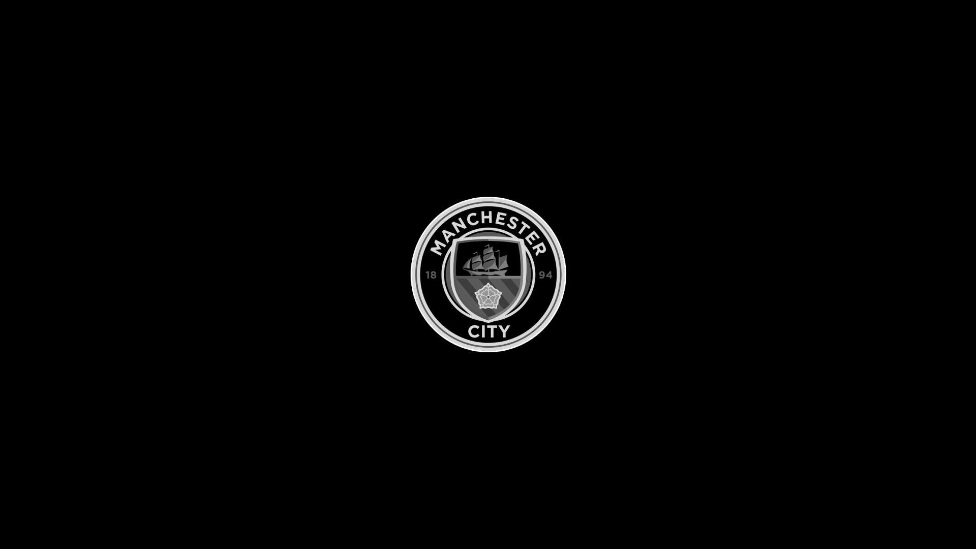 Minimalist Manchester City F.C. logo centered on a black 2K Quad HD PC desktop wallpaper and background.