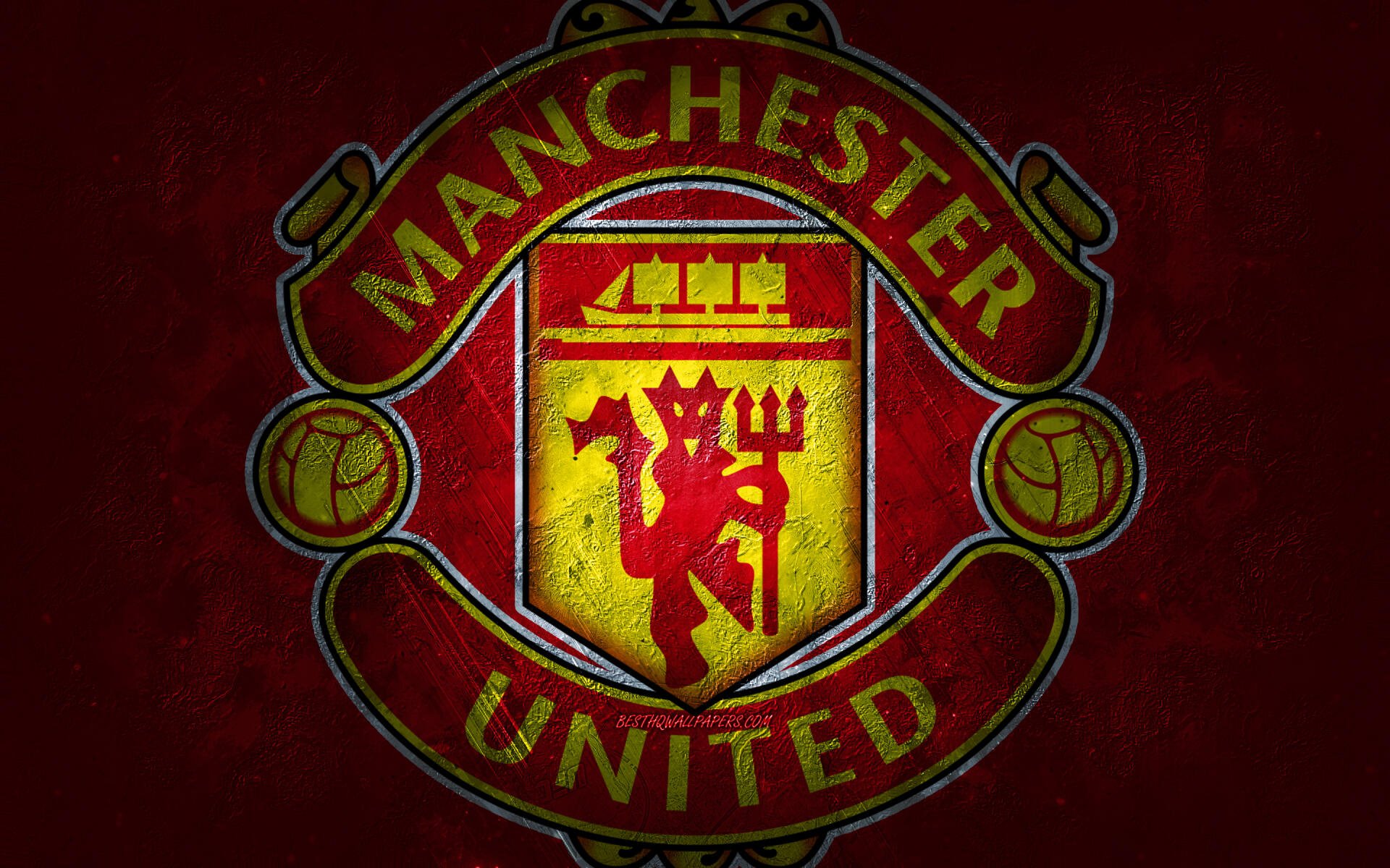 Manchester United F.C. logo centered on a textured dark red background — 2K Quad HD PC desktop wallpaper and background.