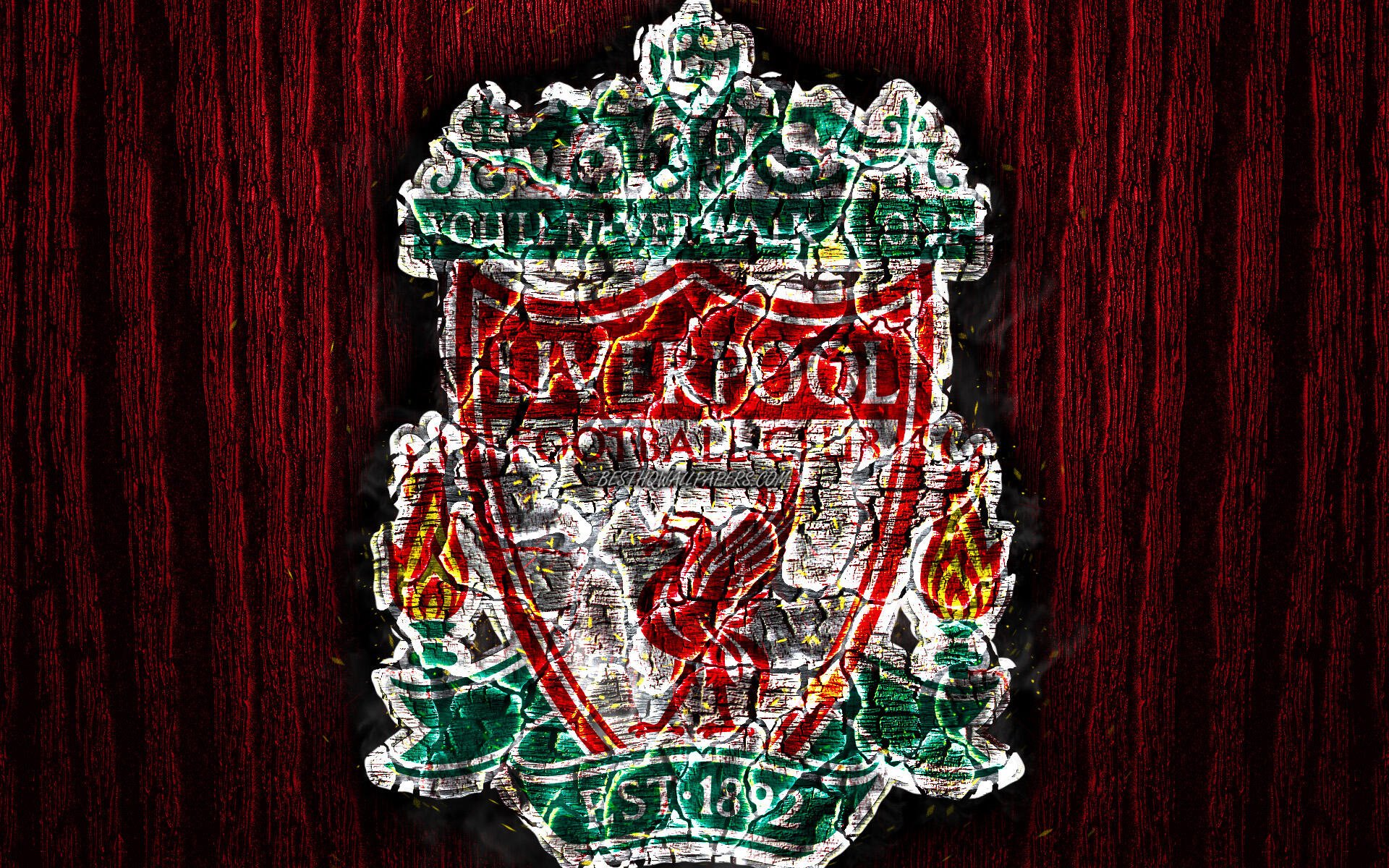 HD PC desktop wallpaper featuring the Liverpool F.C. logo/crest with the liver bird emblem and flanking flames on a textured dark red wood background.