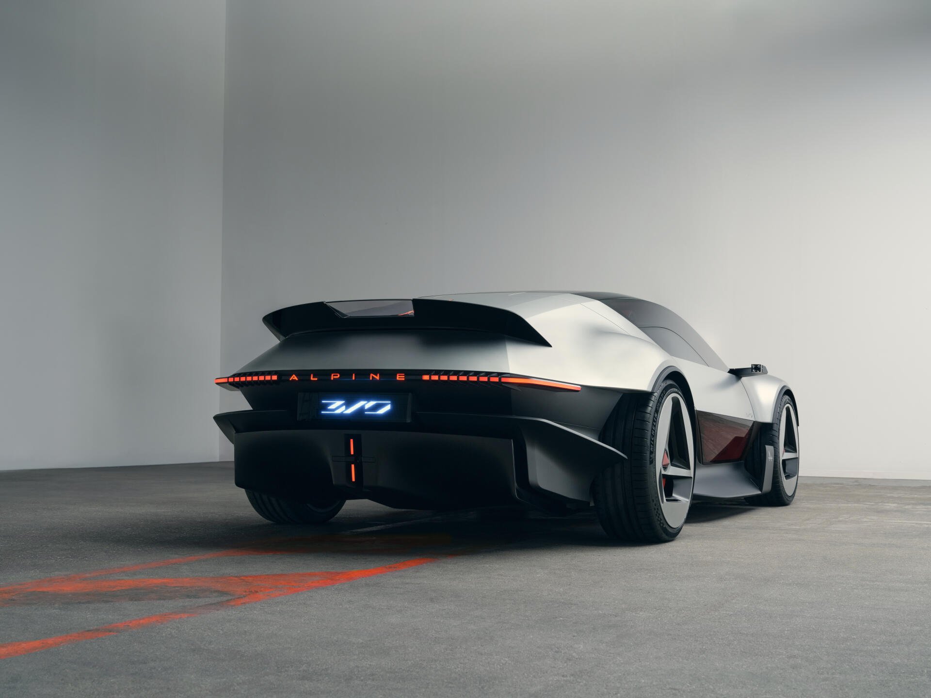 Rear three-quarter view of the Alpine A310 Vision concept sports car, featured in a 5K Ultra HD desktop wallpaper.