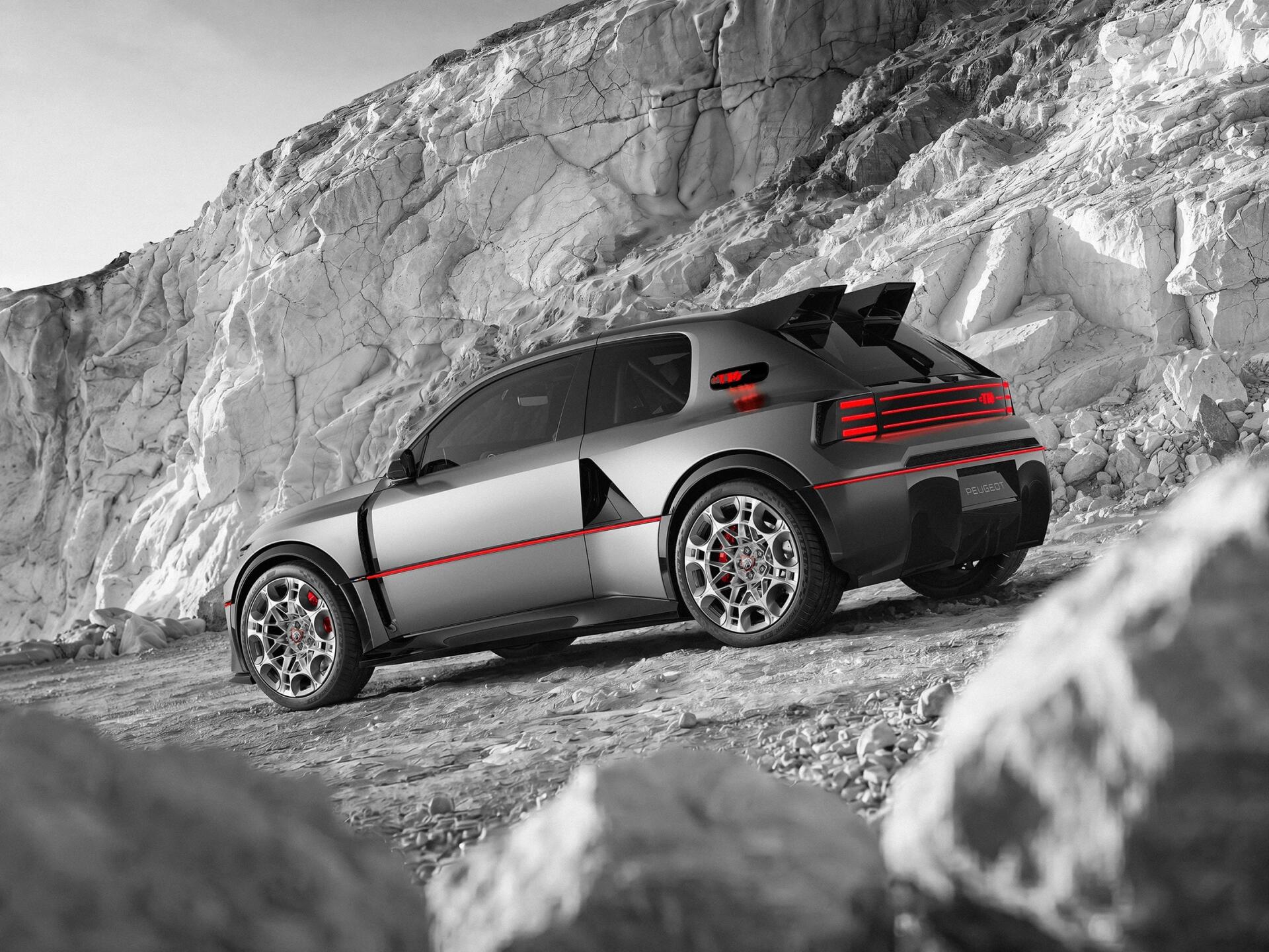 Peugeot E-T16 concept sports car on a rocky mountain trail, featured in a striking HD desktop wallpaper and background.