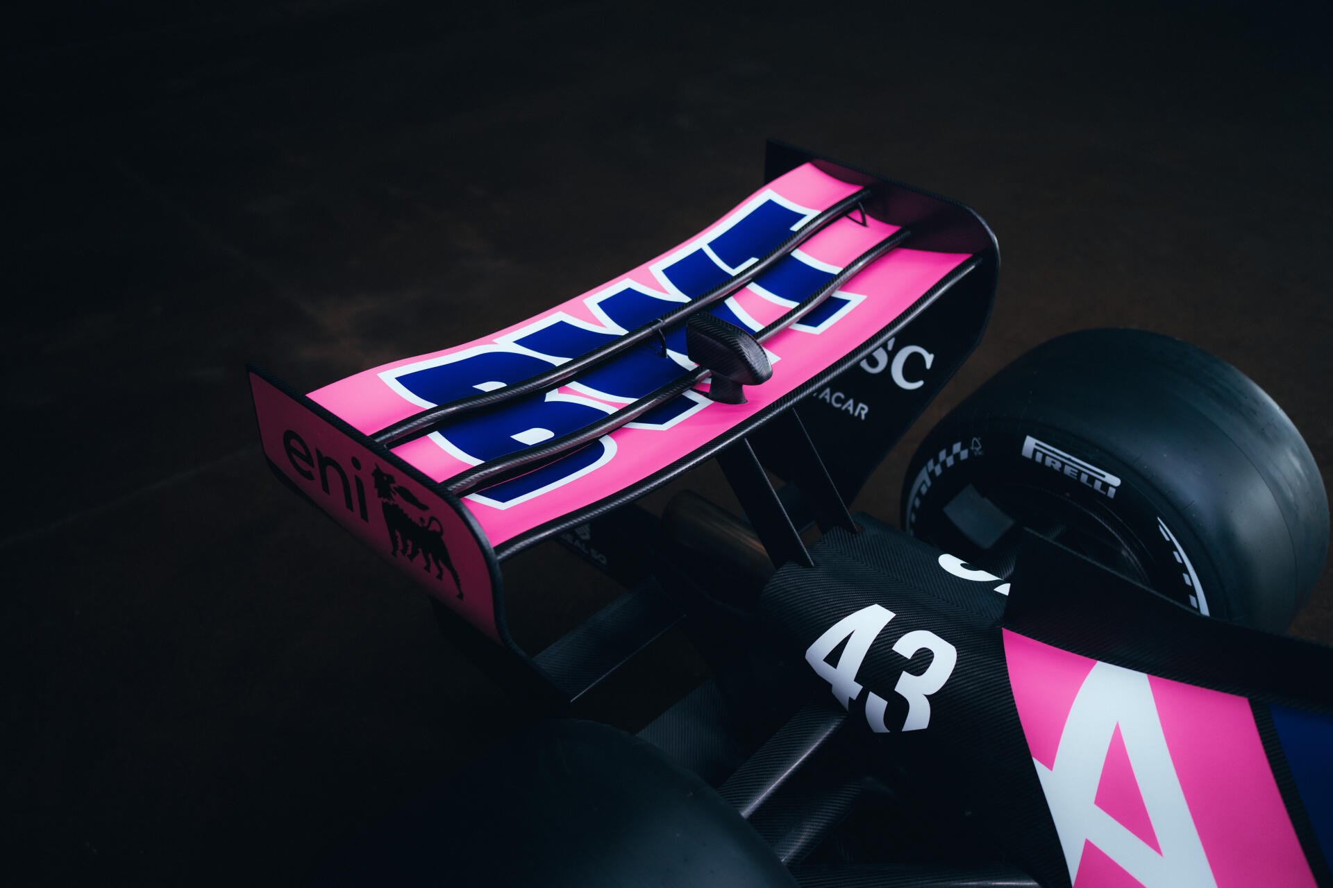 Alpine A526 F1 race car in black and pink livery, shown in a dramatic close-up 8K Ultra HD desktop wallpaper.