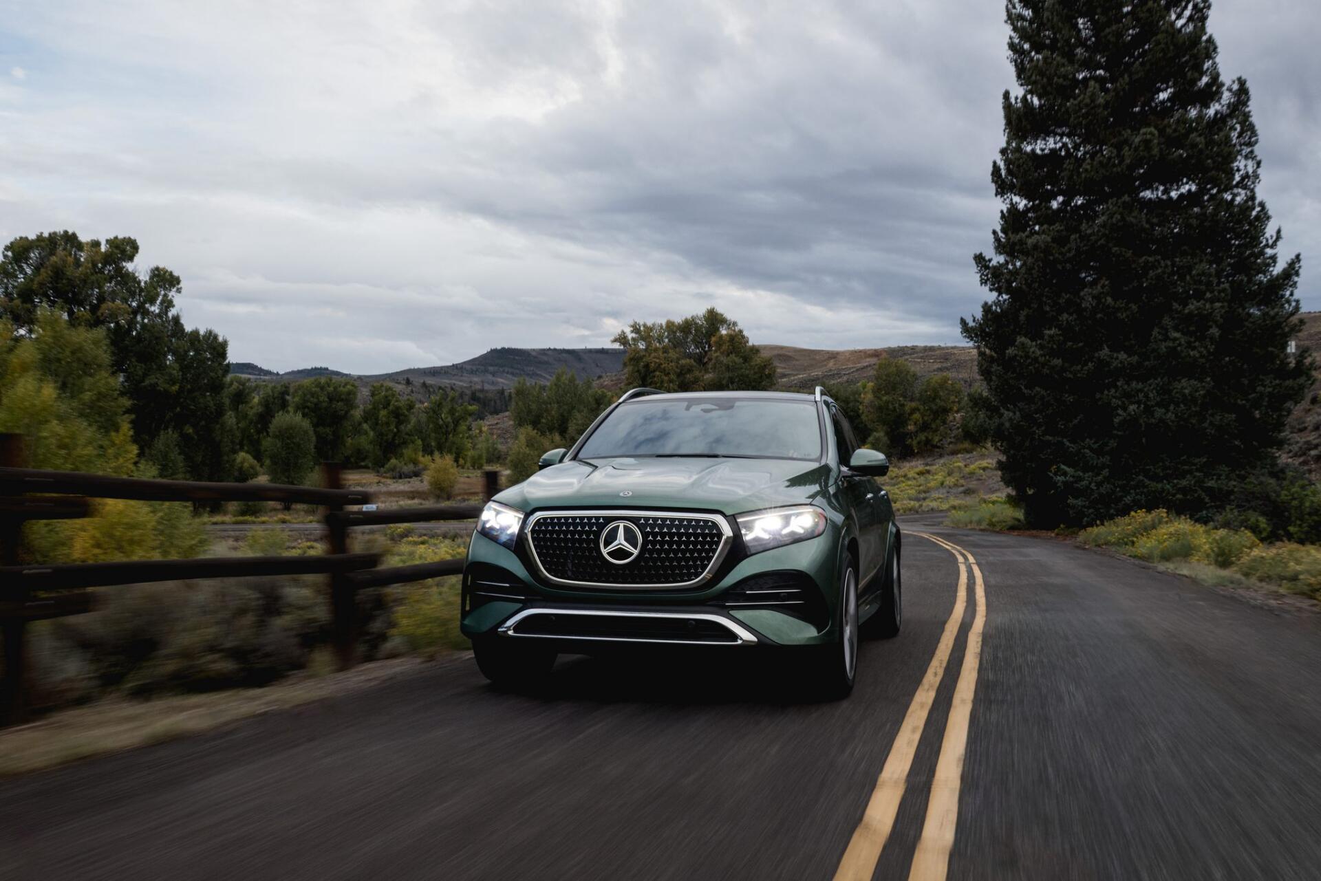 Mercedes-Benz GLS SUV driving a scenic rural road, HD PC desktop wallpaper and background.
