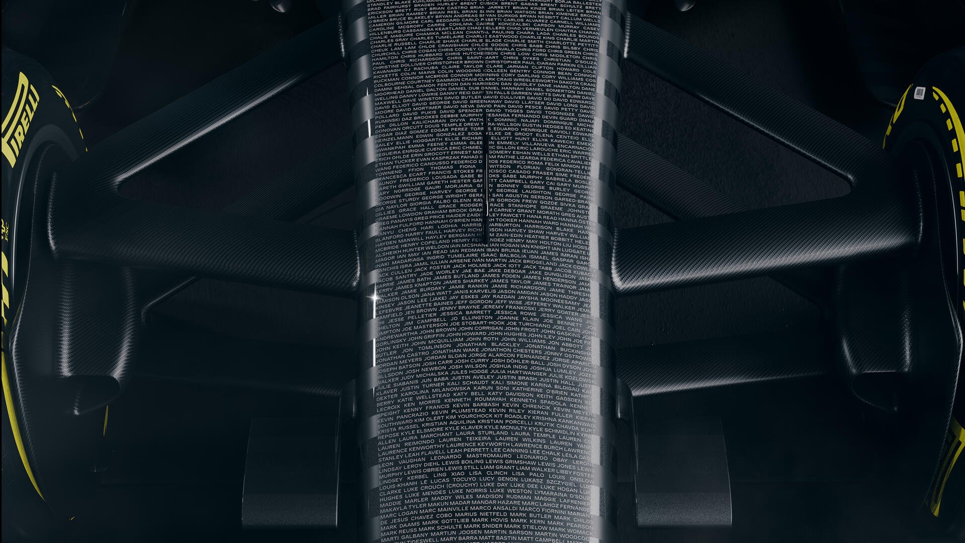 2K Quad HD desktop wallpaper of the Cadillac MAC-26 Formula 1 car, framed by glowing computer code and sleek futuristic architecture.