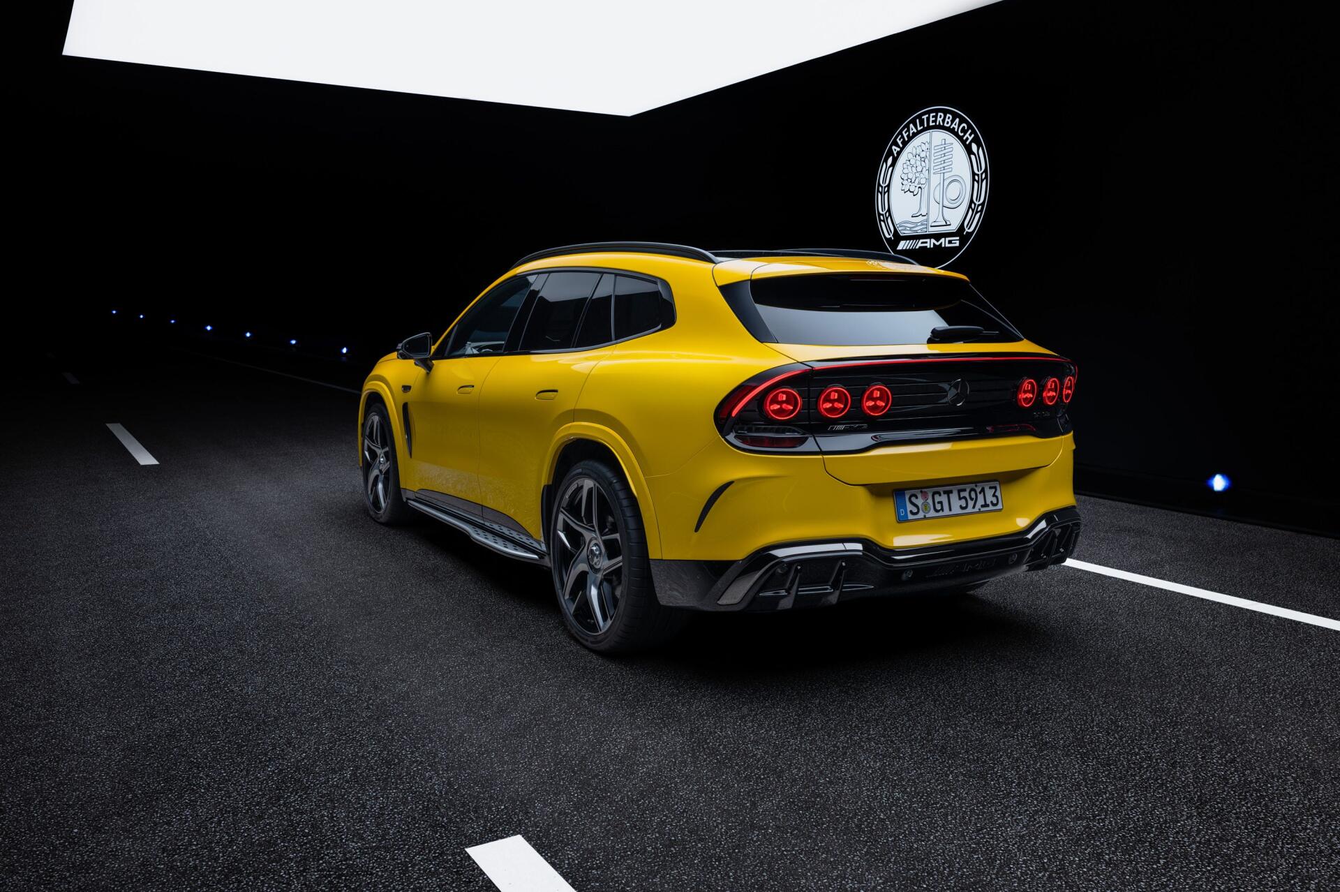Yellow Mercedes-AMG GT SUV sports car on a nighttime road, 2K Quad HD PC desktop wallpaper and background.