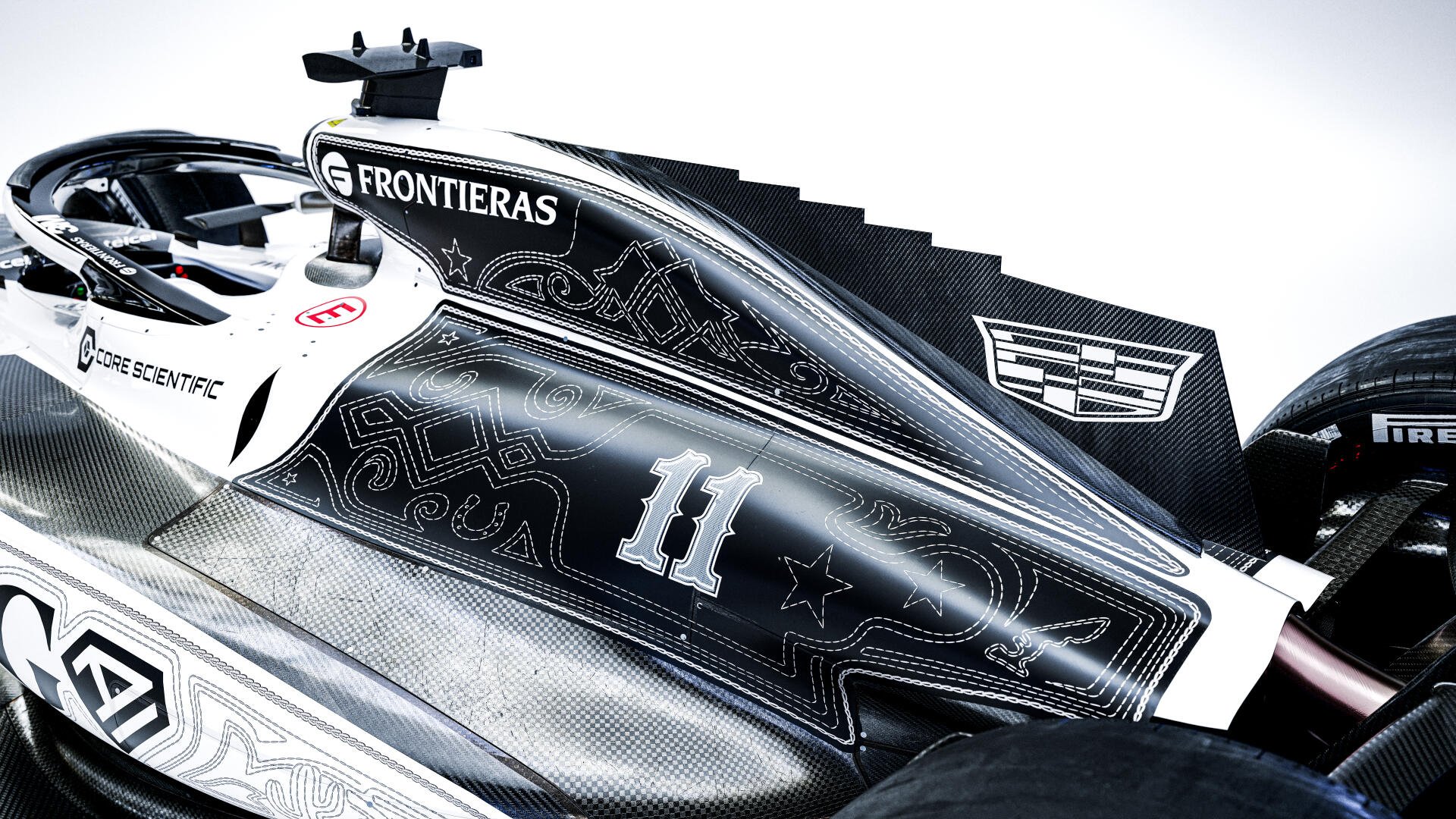 Cadillac MAC-26 F1 race car livery with number 11 and Cadillac crest, 8K Ultra HD desktop wallpaper background.