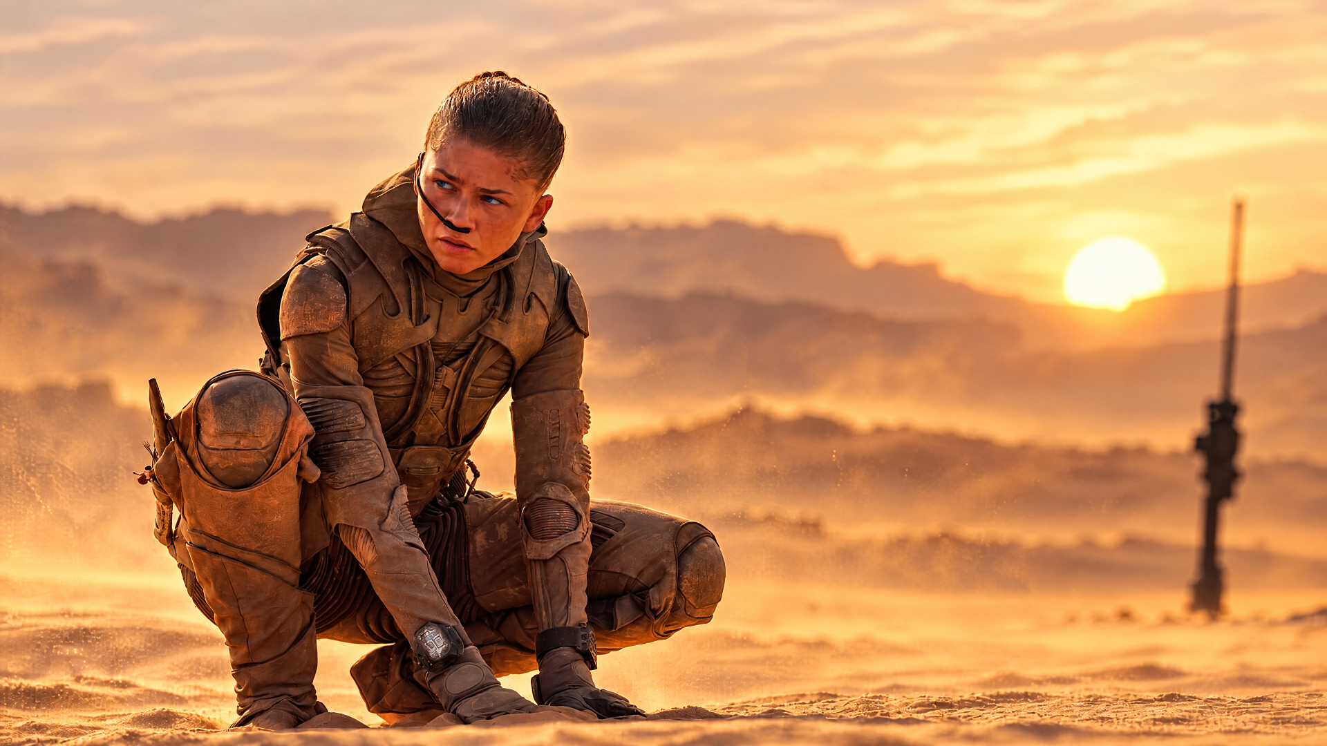 Zendaya as a desert soldier in Dune: Part Three, kneeling beneath a sunset in this 4K Ultra HD desktop wallpaper.