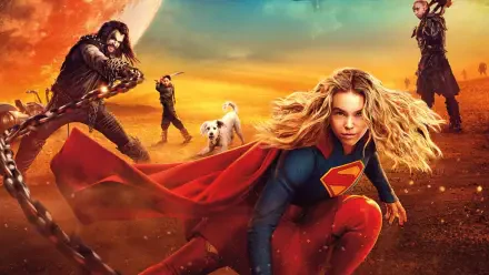 Supergirl (2026) crouches with her red cape billowing against a golden-orange sunset, allies and a white dog in the distance — 4K Ultra HD PC desktop wallpaper/background.