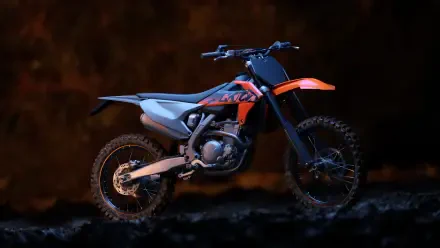 Orange and black dirt bike side profile on dark textured ground with dramatic lighting — 5K Ultra HD PC desktop wallpaper and background.