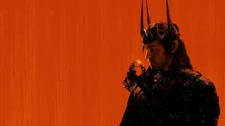 The Lord of the Rings: The Rings of Power 4K Ultra HD PC desktop wallpaper — a crowned dark figure holds a glowing ring against a textured orange background.