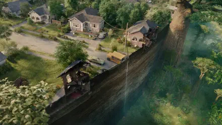 The End of Oak Street — 4K Ultra HD PC Desktop Wallpaper and Background: aerial view of suburban homes split by a dramatic cliff, a street ending at a deep, green-tinged chasm.