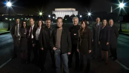 HD PC desktop wallpaper tagged 24: a dozen people stand on a dimly lit bridge at night with an illuminated neoclassical memorial behind them.