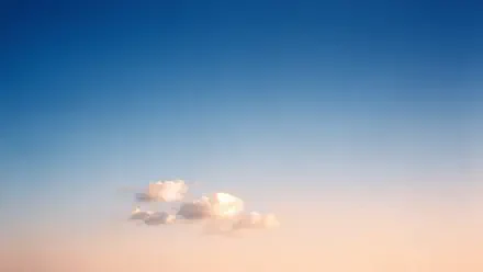 4K Ultra HD PC desktop wallpaper and background: expansive clear sky gradient from deep blue to soft peach with a single fluffy cloud near the horizon.
