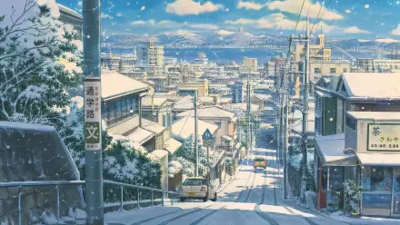 4K Ultra HD PC desktop wallpaper background: snow-covered urban street descending into a winter cityscape, rooftops, streetcars and distant skyline under falling snow.