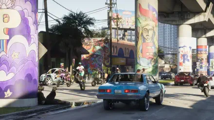 Grand Theft Auto VI (Grand Theft Auto) video game 4K Ultra HD PC wallpaper: blue car drives beneath colorful mural-covered overpass on a bustling urban street with bikers and pedestrians.