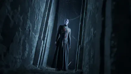 HD PC desktop wallpaper and background: Hellraiser: Revival ghostly monster stands between crumbling stone pillars, pale face and stitched chest bathed in cold blue light.