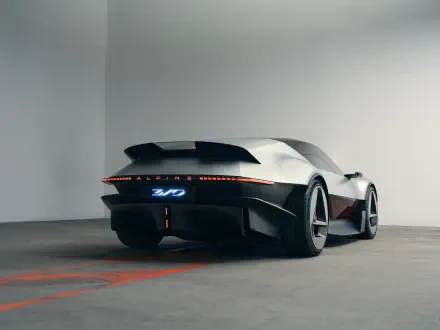 Rear three-quarter view of the Alpine A310 Vision concept sports car, featured in a 5K Ultra HD desktop wallpaper.