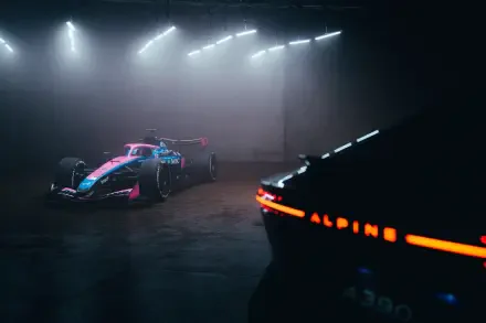 Alpine A526 F1 race car in a dramatic dark studio, featured in an 8K Ultra HD PC desktop wallpaper and background.