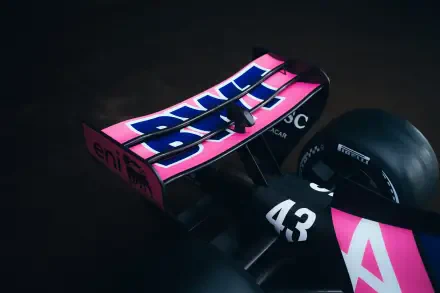 Alpine A526 F1 race car in black and pink livery, shown in a dramatic close-up 8K Ultra HD desktop wallpaper.