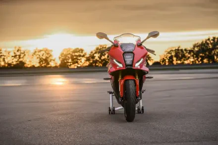 Red BMW Motorrad F 450 RR sport bike facing forward at sunset, 8K Ultra HD desktop wallpaper and background.