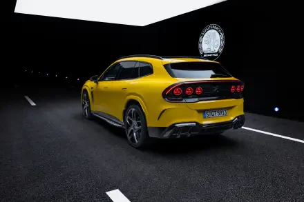 Yellow Mercedes-AMG GT SUV sports car on a nighttime road, 2K Quad HD PC desktop wallpaper and background.