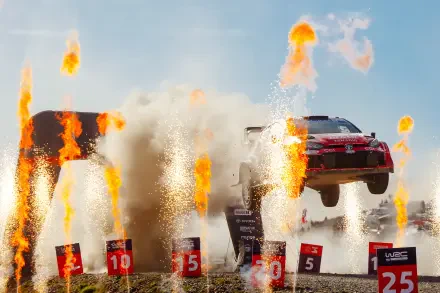 Toyota Gazoo Racing GR Yaris Rally1 airborne amid flames and sparks in a WRC scene, 4K Ultra HD desktop wallpaper.