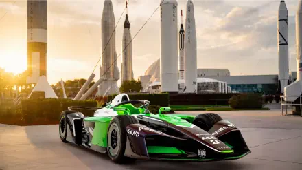 Envision Racing Formula E electric race car at sunset, 8K Ultra HD desktop wallpaper and background.