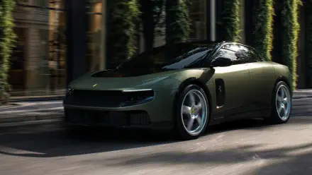 Dark green Ferrari Luce luxury sports car driving past a city park, featured in a 4K Ultra HD PC desktop wallpaper and background.