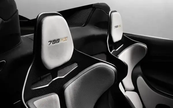 McLaren 788HS vehicle interior: carbon-fiber cockpit and white racing seats, 8K Ultra HD PC desktop wallpaper/background.