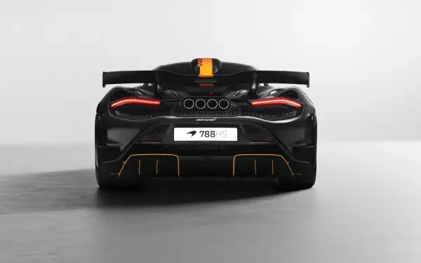 8K Ultra HD PC desktop wallpaper: rear view of a black McLaren 788HS vehicle with glowing taillights, orange racing stripe, and minimalist gray background.