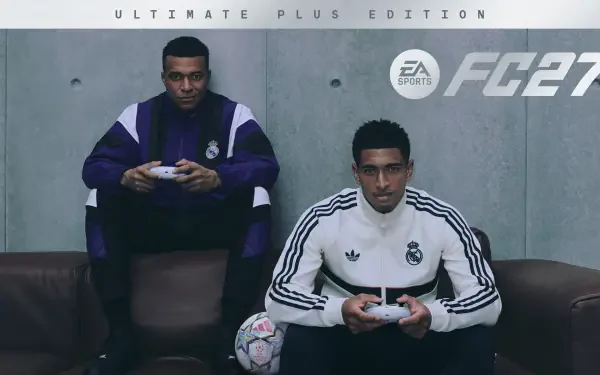 2K Quad HD PC desktop wallpaper showing two gamers in Real Madrid tracksuits holding controllers on a couch, a soccer ball at their feet and the EA SPORTS FC 27 logo behind them.