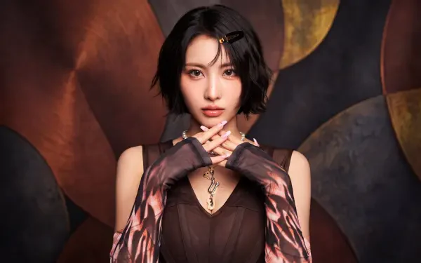 Close-up portrait of a short-haired woman posed like a k-pop idol/Japanese model, wearing patterned gloves and a dark dress against a warm abstract backdrop; 5K desktop wallpaper.