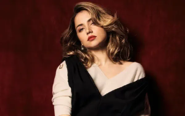 Glamorous female celebrity actress portrait against a deep red backdrop, soft waves and an elegant draped outfit — 4K Ultra HD PC desktop wallpaper and background.