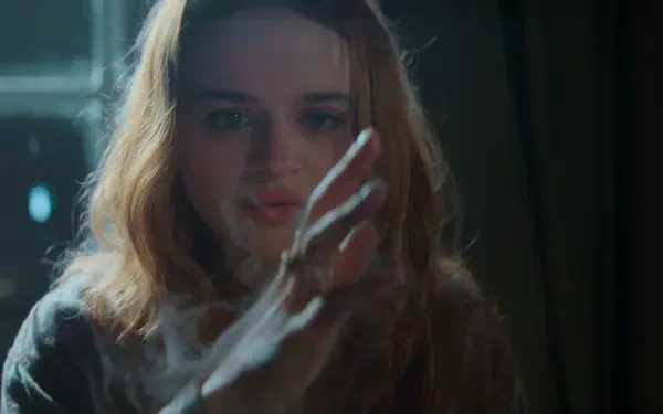 Cinematic portrait of a young woman touching a pane of glass with an outstretched hand, soft backlight and moody tones; 2K Quad HD PC desktop wallpaper/background.