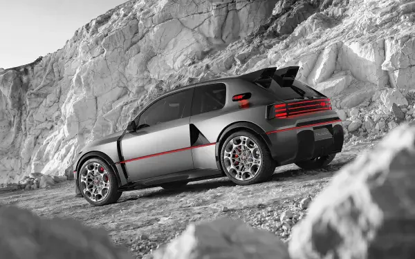 Peugeot E-T16 concept sports car on a rocky mountain trail, featured in a striking HD desktop wallpaper and background.