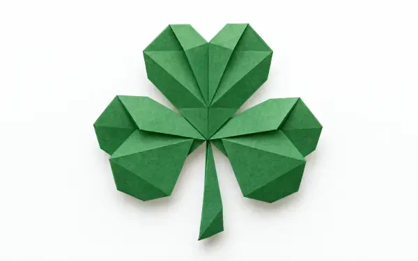 Green origami shamrock clover paper craft on a white background, 4K Ultra HD desktop wallpaper.