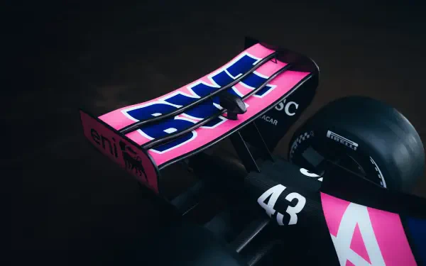 Alpine A526 F1 race car in black and pink livery, shown in a dramatic close-up 8K Ultra HD desktop wallpaper.